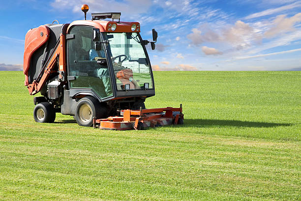istock Professional motorized ride on lawn mower cutting fresh grass 2206637010