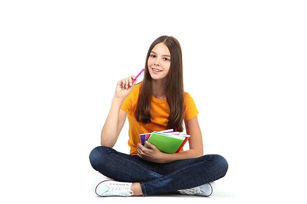 istock Young girl with notebooks on white background 2206637068