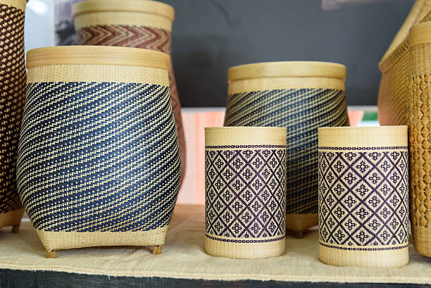 A collection of intricately crafted rattan vases and baskets, showcasing traditional artisanal techniques. Perfect for home decor, these eco-friendly pieces add a touch of natural elegance.