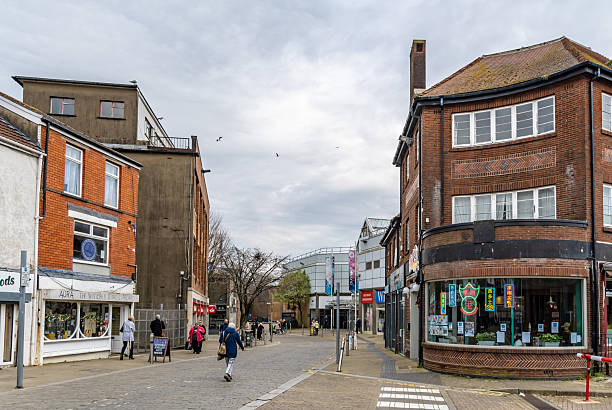 Swansea, UK. 19 March 2025. Shops and shoppers in Swansea City Centre