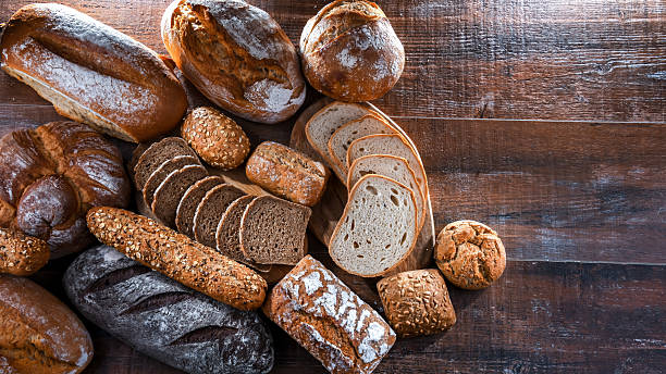 istock Assorted bakery products including loaves of bread and rolls 2206638634