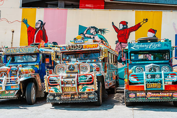 Colorful Jeepney Buses Parked at a Bustling Station in Baguio, Philippines stock photo
