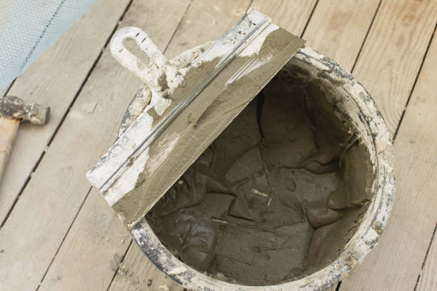 Spatula on bucket of glue