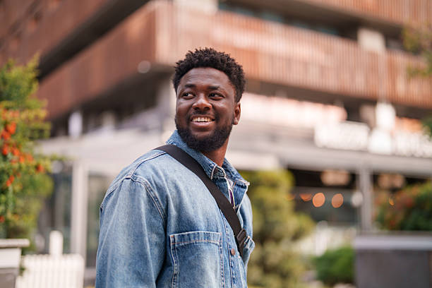 istock Young Black Man Walking Through the City 2206639081