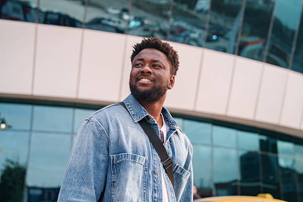 istock Young Black Man Walking Through the City 2206639326