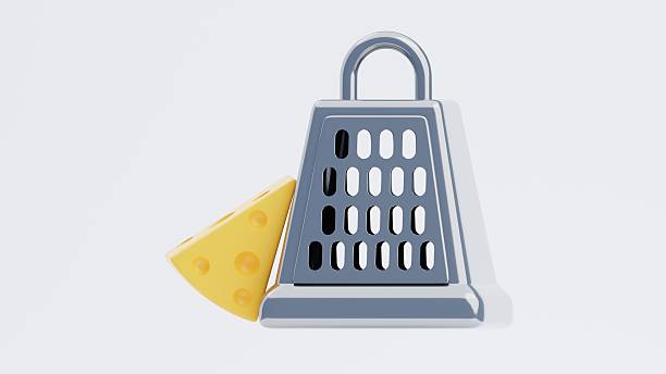 A close-up shot of a metal grater on a table, perfect for still life photography or kitchen scenes.