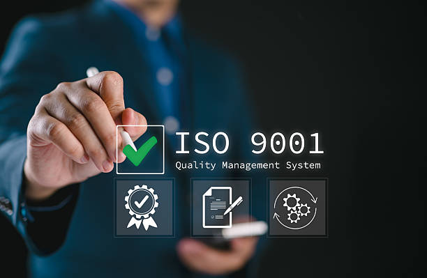 istock QMS, ISO 9001 Quality Management System concept. Certified and quality management of organizations Businessman using smartphone to choose ISO 9001 on virtual screen. 2206642975