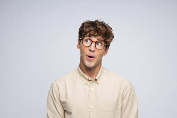 istock Headshot of surprised young man 2206643052