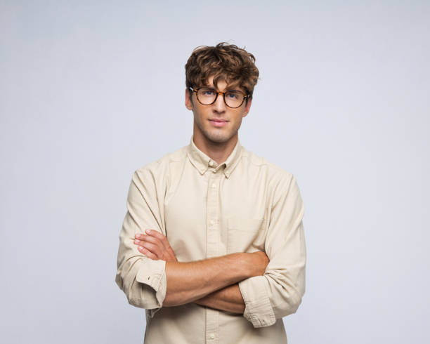 istock Studio portrait of handsome young Caucasian man with glasses 2206643733