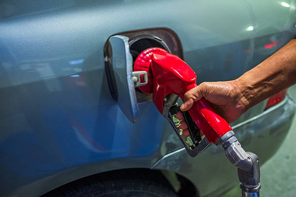 istock Hand refilling the car with fuel at the refuel station 2206648009