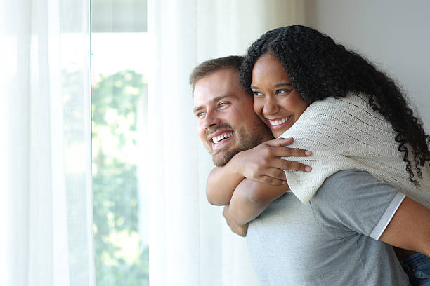 istock Funny interracial couple enjoying at home 2206648334