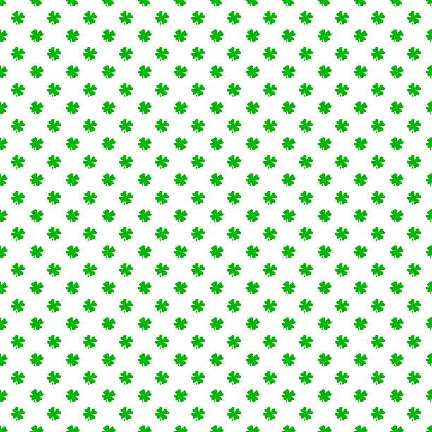 Seamless pattern of green four-leaf clover leaves on white background