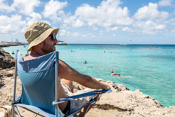 istock Relaxed Man Enjoying Ocean View on a Sunny Day 2206654419