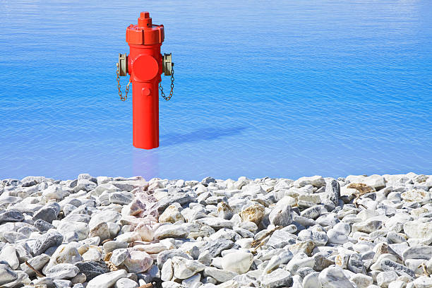 istock An improbable hydrant at the seaside. Plenty of water concept image 2206655779