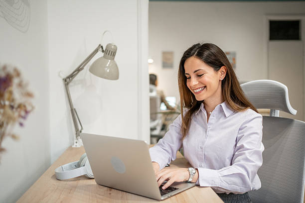 istock Young businesswoman working from home smiling and using laptop 2206659041
