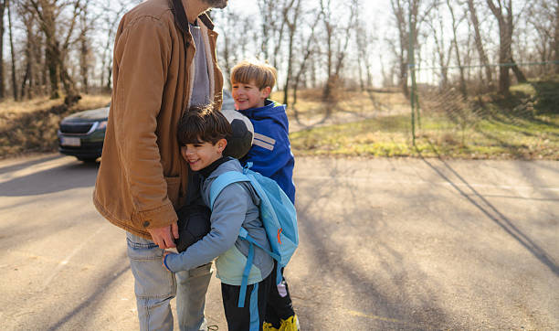 Photo of father and his sons on a soccer court