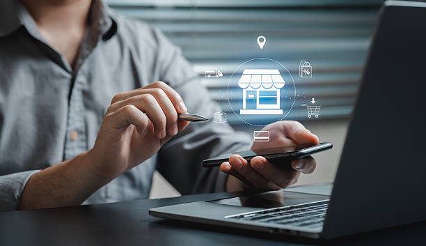 istock Man Using Smartphone for Online Shopping with Laptop Background 2206661317