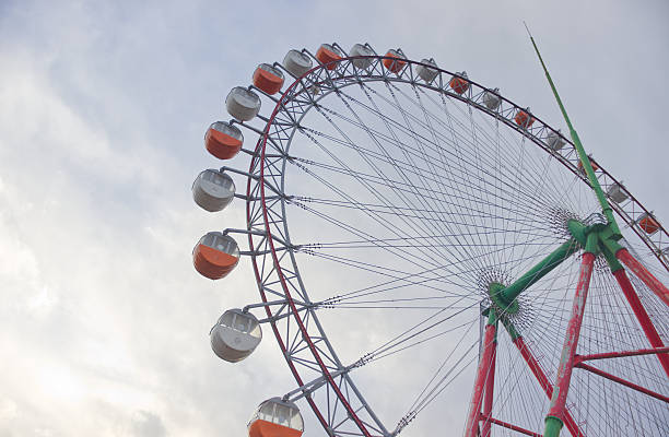 istock Ferris wheel with clouds and sky 2206662106