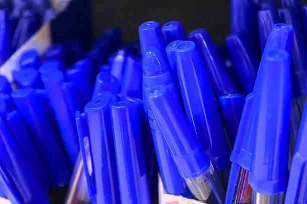 istock Blue pens crowded together create a striking visual in an office supply store 2206666325