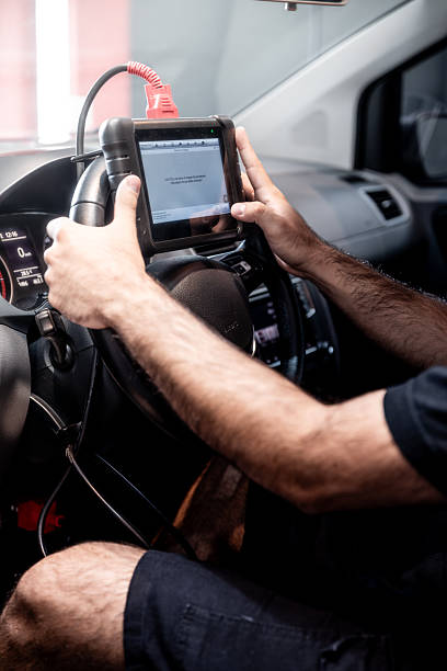 istock Automotive diagnostic scanner connected to the vehicle system 2206667096