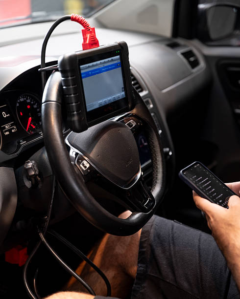istock Automotive diagnostic scanner connected to the vehicle system 2206667103