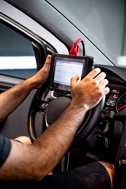 istock Automotive diagnostic scanner connected to the vehicle system 2206667117