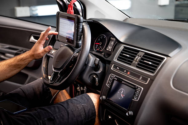 istock Automotive diagnostic scanner connected to the vehicle system 2206667124