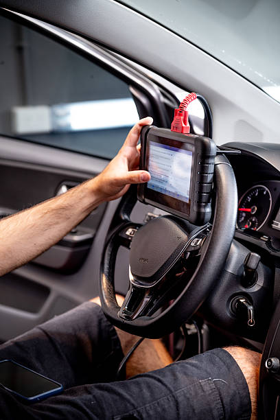 istock Automotive diagnostic scanner connected to the vehicle system 2206667125