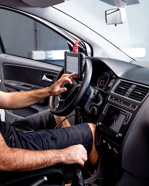 istock Automotive diagnostic scanner connected to the vehicle system 2206667137