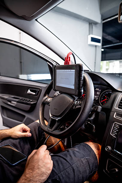istock Automotive diagnostic scanner connected to the vehicle system 2206667144