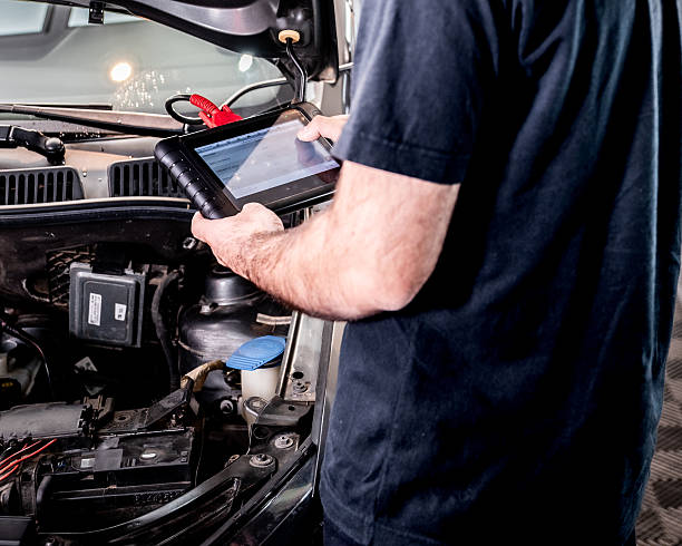 istock Automotive diagnostic scanner connected to the vehicle system 2206667158