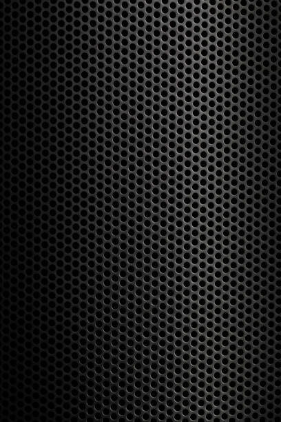 istock Texture of a perforated metal sheet with a uniform pattern and shadows captured in low light showcasing industrial design elements 2206671187