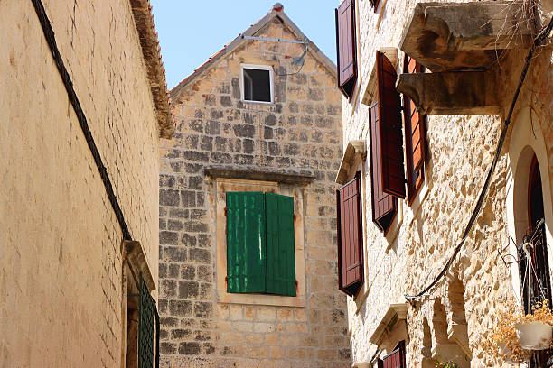 Picturesque Mediterranean street and traditional architectural details in Trogir, Croatia.
