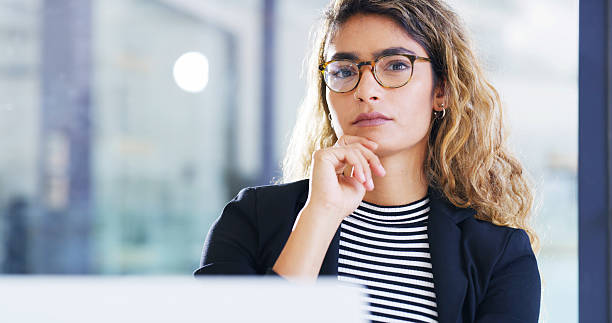 istock Thinking, business and woman in office, computer and confidence with connection, copywriting and glasses. Face, laptop and employee in workplace, eyewear and journalist with magazine editor 2206672084