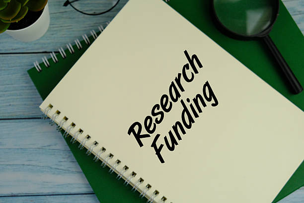 istock Research funding on white paper background 2206673389