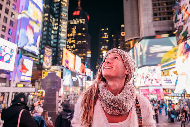 istock Woman Enjoying Nightlife in Times Square 2206674149