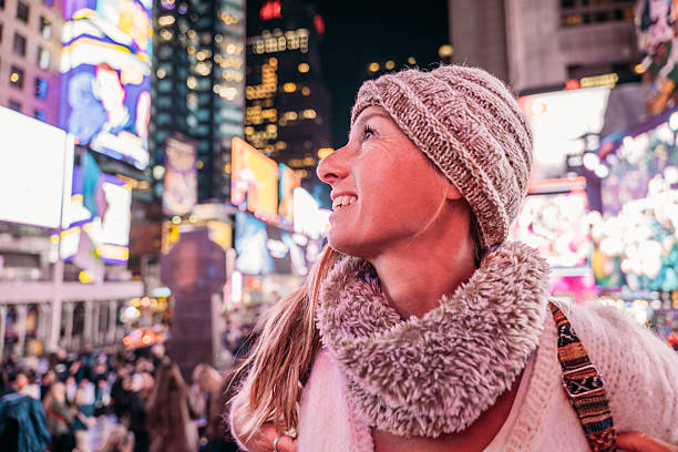 istock Woman Enjoying Nightlife in Times Square 2206674155