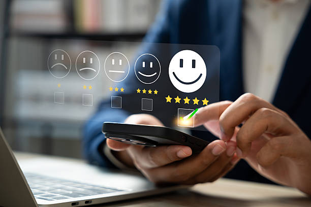 istock Customer satisfaction survey concept, Businessman using smartphone touch happy smiley icon, 5 star service experience rating, Feedback, Online review, Online application, Quality satisfaction review. 2206674439