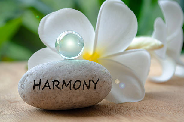 Harmony text on stone with shining marbles. Peace and harmony concept.