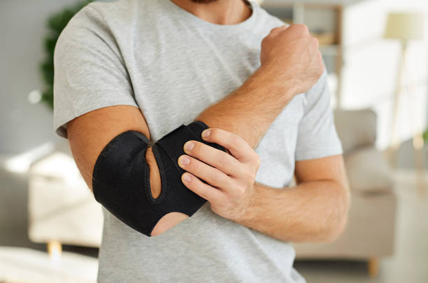 istock Man with bandage on arm after bone fracture 2206675641