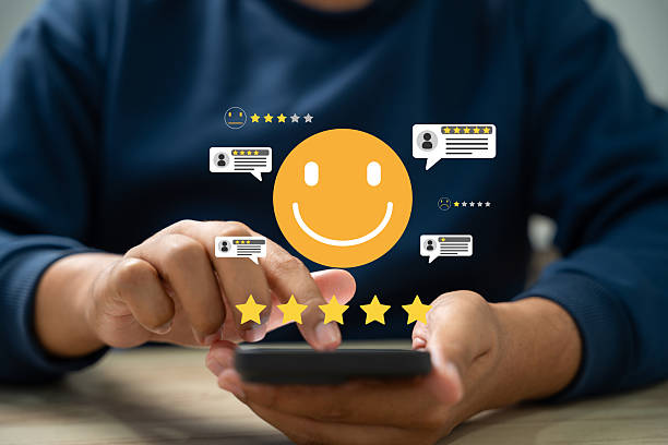istock Customer satisfaction survey, Customer using smartphones to rate their experience with five stars,Online application service featuring happy smiley icons,feedback, Online service quality evaluation. 2206675983