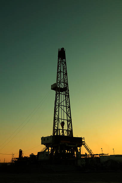 istock Oil drilling derrick in oilfield 2206677887