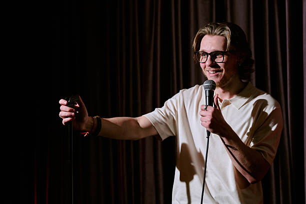 istock Smiling Comedian Performing Stand-Up Comedy Show 2206678401