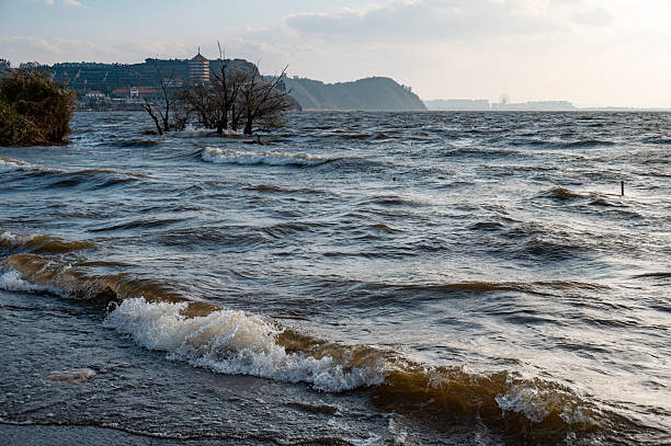 istock The waves crash against the beach landscape at dusk 2206683868
