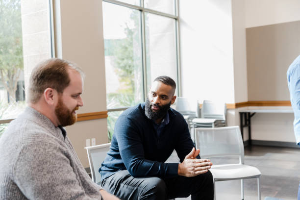 istock Two Men in Casual Clothing Having a Discussion 2206686171