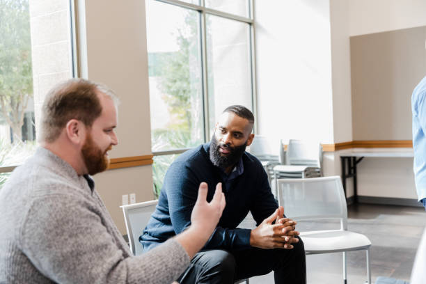 istock Two Men in Casual Clothing Having a Discussion 2206686172