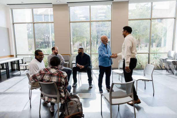 istock Diverse Group Therapy Session: Men and Women in Discussion 2206686185