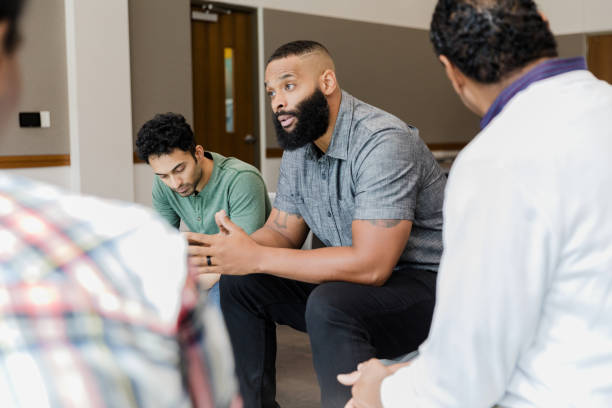 istock Men in group therapy session, discussing mental health 2206686224