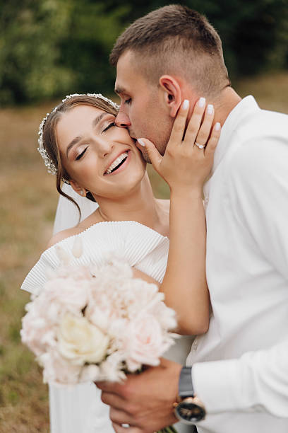 istock A bride and groom are kissing each other's lips 2206686648