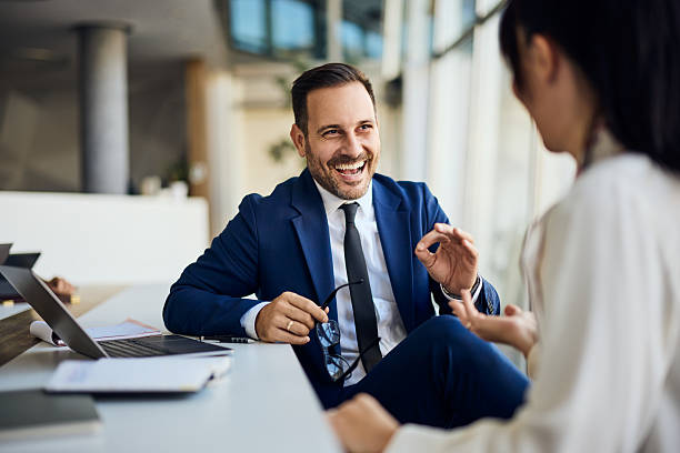 istock Professional Business Conversation Between Two Colleagues in a Modern Office Setting 2206687035